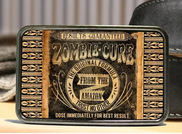 The Zombie Cure is one of most unique belt buckles that are completely metal (image area too) and are made to be durable and lasting! Lots of details in the image and slightly smaller than most of our buckle selection. Available at our Smyrna, TN shop a short ride from downtown Nashville.

Belt Buckle Measures: -3"x2"
Fits any snap belt up to 1 1/2"
Listing is for the belt buckle only &amp; does not include a belt strap.