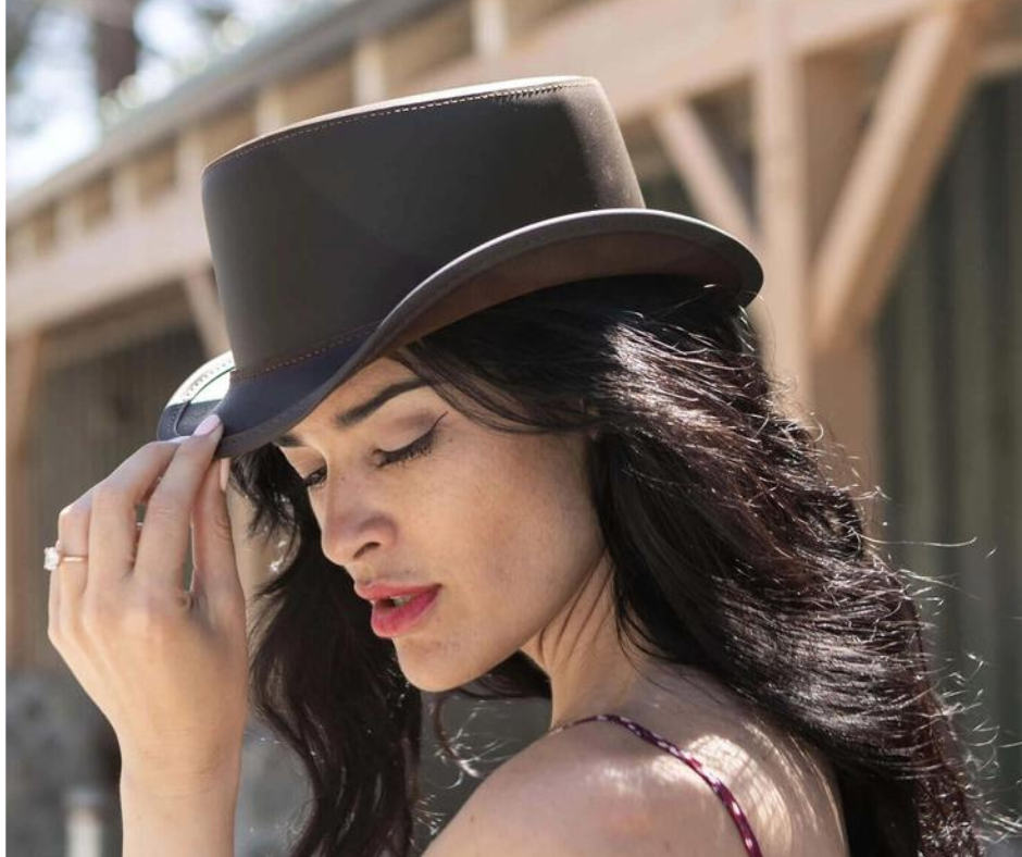 The Bromley is a Throwback style hat to 1800's west for Villains or Bankers. It's small streamlined 1 1/2"Brim, Low understated 3" Crown&nbsp; made from Cowhide Leather.&nbsp; The Bromley leather top hat sports a practical Vintage but updated look and it's made in the USA. It's available for purchase at our retail shop in Smyrna, TN, just outside of Nashville. Sizes S,M,L,XL.