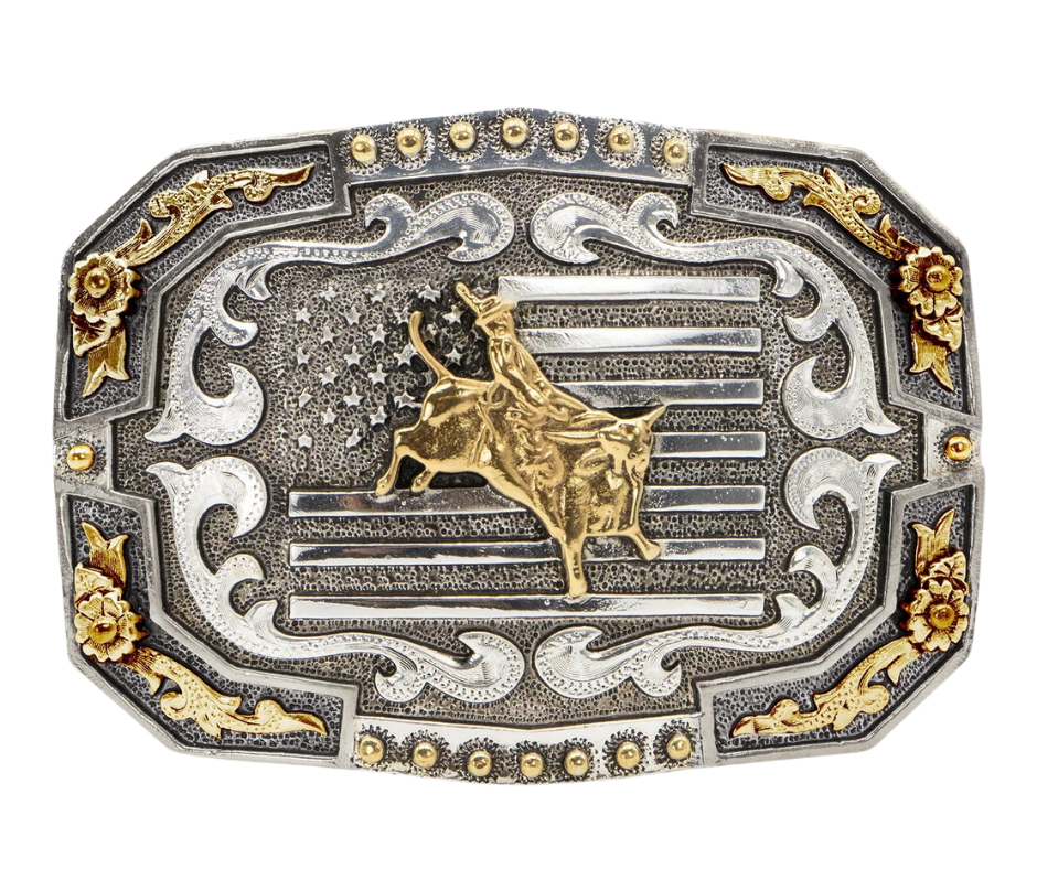 This stylish, oval-shaped buckle features an all-American designs of bullriding motif and a bold USA flag background. It has an antique silver finish with gold accents, giving it a handmade look. Measuring 2 3/4" in height by 3 3/4" in width, it is suitable for belts up to 1 1/2" wide. You can buy it online or in our Smyrna, TN store near Nashville. Proudly made in Mexico.