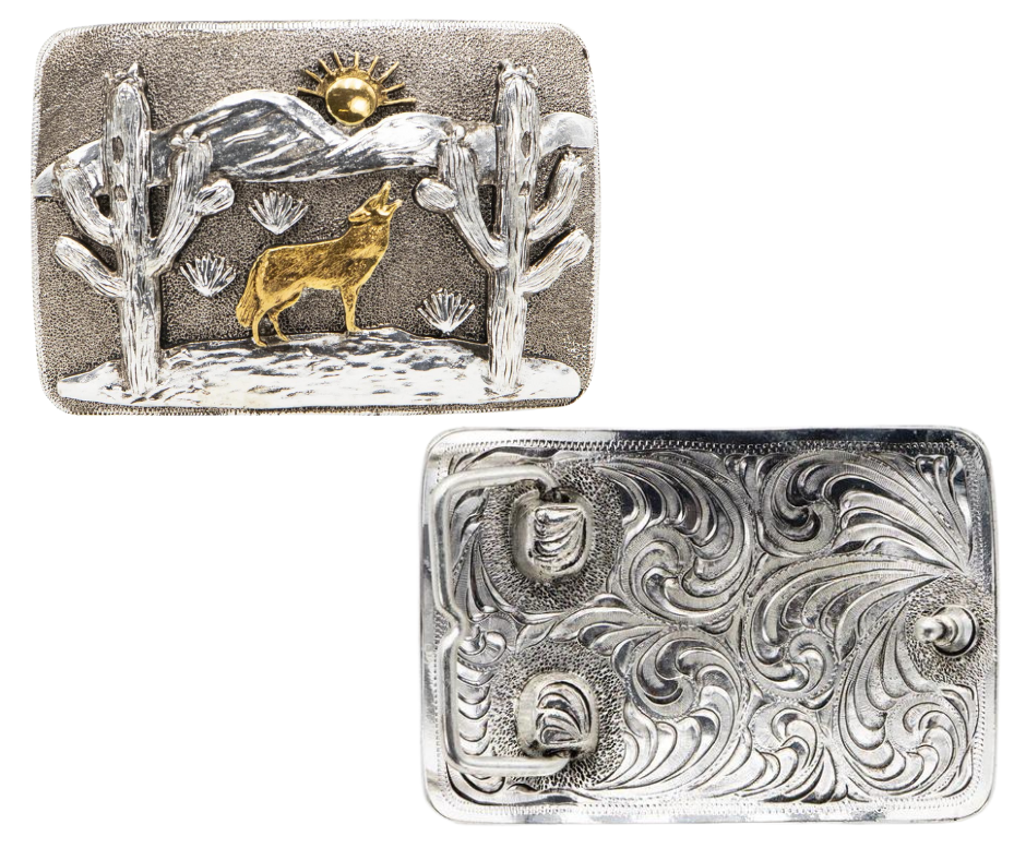 The Desert Coyote Belt Buckle features an intricate design of a howling coyote against a backdrop of mountains and cacti. With its antique gold and silver finish, this affordable option is a stylish addition to any wardrobe. Measuring 2 3/4" in height and 4" in width, the rectangular shape ensures a comfortable fit on belts up to 1 3/4" wide. You can easily purchase this buckle online or at our shop in Smyrna, TN, located just outside of Nashville.