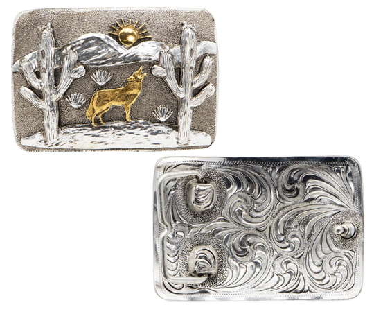 The Desert Coyote Belt Buckle features an intricate design of a howling coyote against a backdrop of mountains and cacti. With its antique gold and silver finish, this affordable option is a stylish addition to any wardrobe. Measuring 2 3/4" in height and 4" in width, the rectangular shape ensures a comfortable fit on belts up to 1 3/4" wide. You can easily purchase this buckle online or at our shop in Smyrna, TN, located just outside of Nashville.