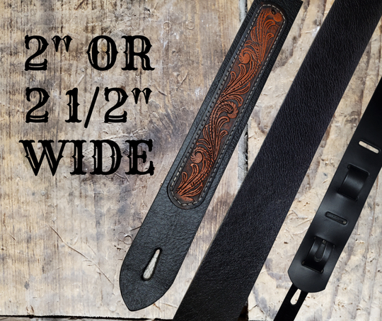 Electric Guitars, Great Songs and Lyrics have been staple for years in Country music!  "This 2" or 2 1/2" wide Guitar Strap is a nod to that classic influence. The main Body of the strap is approx. 1/8" thick Black Leather Strap.  CUSTOMIZE your Color options on a  Western Floral LEATHER PATCH. The classic adjustment style goes from approx. 42" to 56" at it's longest . Made just outside Nashville in our Smyrna, TN. shop. It will need a bit of time to "break in" but will get a great patina over time. 