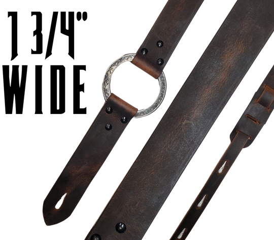 Great Musicians, Singers and great songs have been a staple for years in Nashville. Be on your way starting your journey with this  Vintage styled 1 3/4" "main Body of the Guitar strap is approx. 1/8" thick with a Scroll pattern stainless steel ring. Choose solid Black or Distressed Brown. The classic adjustment style goes from approx. 42" to 56" at it's longest . Made just outside Nashville in our Smyrna, TN. shop. It will need a bit of time to "break in" but will get a great patina over time. 