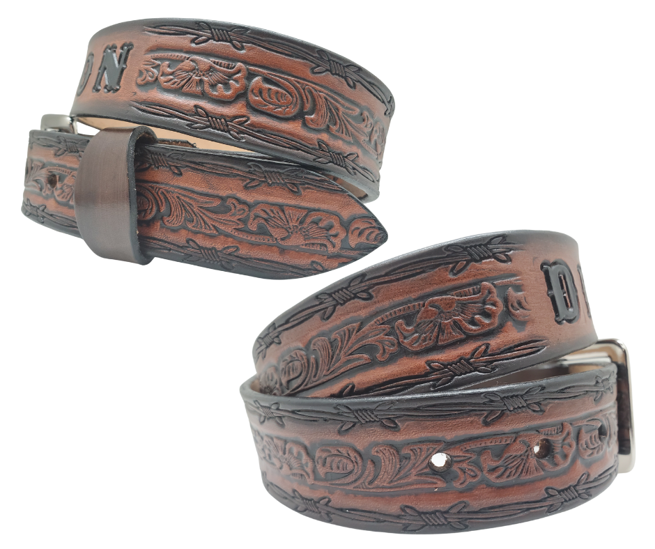 The "Bandit" Name Belt is perfect for those seeking an epic escape. It's handcrafted in Smyrna, Tennessee, just outside Nashville, and features a 1 1/2" width with a strip of vegetable tanned leather. The bold design includes an embossed Barbwire border and Western Scroll center pattern, while the changeable solid brass buckle in antique nickel finish adds a rugged touch. Make your escape in style with this hand-stained belt.