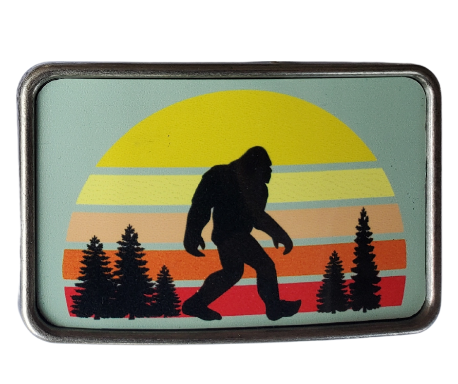 The Sunset Bigfoot is one of most unique belt buckles that are completely metal (image area too) and are made to be durable and lasting! Lots of details in the image and slightly smaller than most of our buckle selection. Available at our Smyrna, TN shop a short ride from downtown Nashville.

Belt Buckle Measures: -3"x2"
Fits any snap belt up to 1 1/2"
Listing is for the belt buckle only & does not include a belt strap.