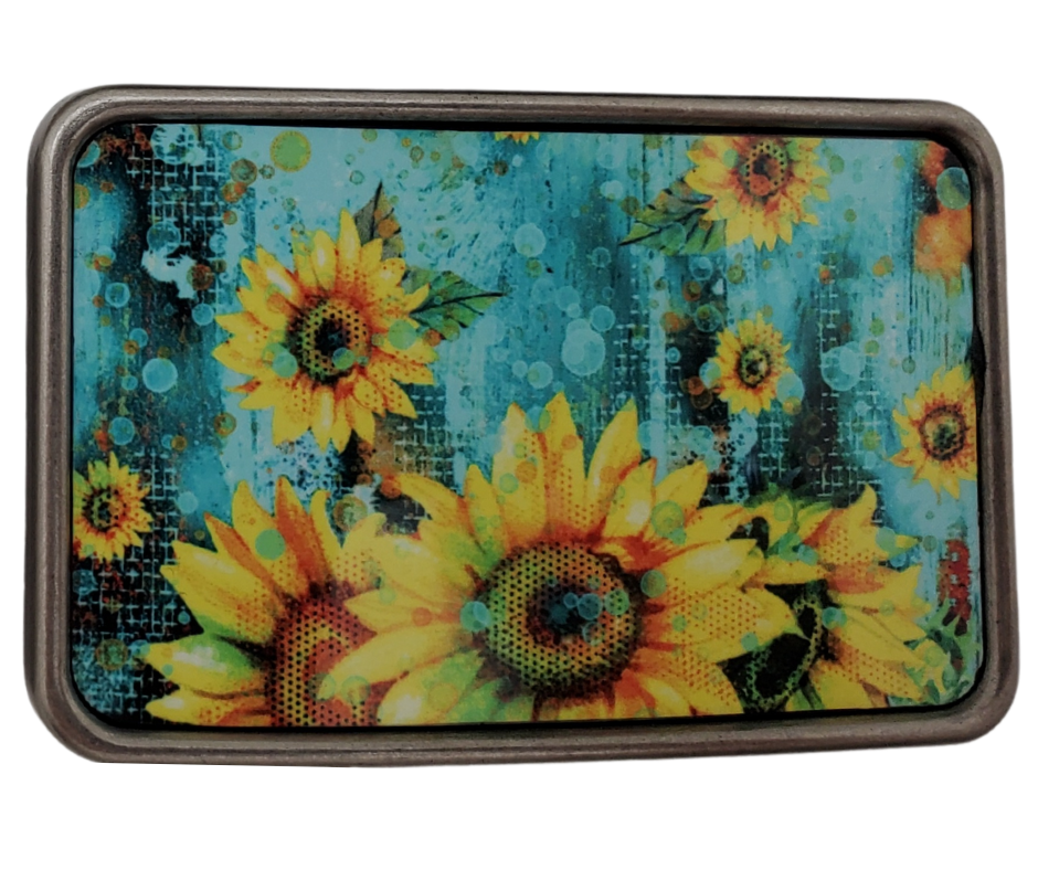 The Raining Daisies is one of most unique belt buckles that are completely metal (image area too) and are made to be durable and lasting! Lots of details in the image and slightly smaller than most of our buckle selection. Available at our Smyrna, TN shop a short ride from downtown Nashville.

Belt Buckle Measures: -3"x2"
Fits any snap belt up to 1 1/2"
Listing is for the belt buckle only &amp; does not include a belt strap.