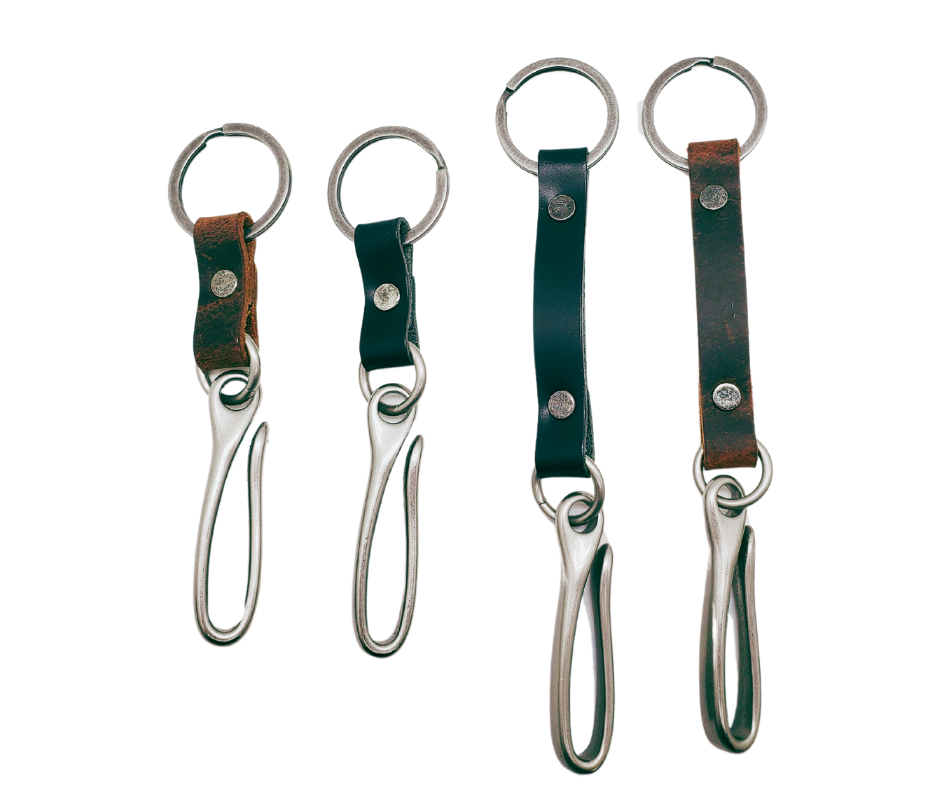 Keep your keys within reach with the Fish Hook Leather Belt Key Holder! Simply hook it onto your belt or belt loop and let it hang in your pocket. The key ring and hook are secured together by a piece of leather, making it convenient and easy to use. Available in both long and short options, you can go about your day knowing your important keys are always with you. Attach it to your belt, bag, or wherever you need it. Handcrafted in our Smyrna, TN shop, just outside of Nashville, TN.