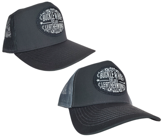 Upgrade your cap game with the Buckle and Hide Classic Trucker Cap. It boasts a fashionable mesh back, structured top, and a convenient snap back closure. The cap comes in Black, Gray/Black with the iconic Buckle and Hide patch on the front. Get yours now from our popular leather shop in Smyrna, TN, just outside of Nashville.