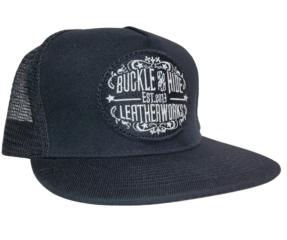 Upgrade your cap game with the Buckle and Hide Classic Flat Bill Trucker Cap, featuring a stylish mesh back, structured top and a snap back. Choose from Black, Grey, Gray/Black or Blk/Gray and proudly wear the Buckle and Hide patch on the front. From your favorite leather shop in Smyrna, TN, just outside of Nashville.