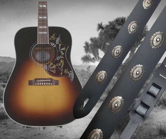 Southwest influenced Concho's have been staple for years in music!  "This 2" wide Guitar Strap is a nod to that classic influence. It's made from 1/8" thick Distressed Brown Water Buffalo or Classic Black Cowhide and after some gig's it'll look like you bought in a Vintage shop. The classic adjustment style goes from approx. 42" to 56" at it's longest . Made just outside Nashville in our Smyrna, TN. shop. It will need a bit of time to "break in" but will get a great patina over time.  