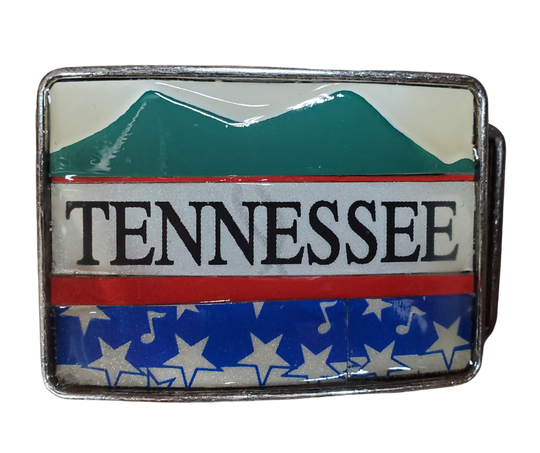 Hand Crafted Tennessee mountains look with our handmade license plate belt buckle. It's a great choice for cheering on your favorite Tennessee teams or for celebrating the great volunteer state! This eye-catching piece measures approx. 3" x 4" and can be matched with any 1 1/2" belt. Get yours today from our Smyrna, TN (near Nashville) store or online and show your style!