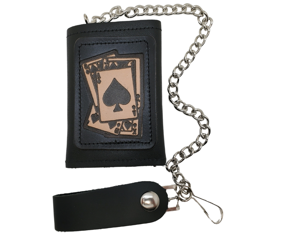 <span>Spade card hand pattern Leather Patch all leather Tri-fold Chain Wallet. 1 Cash Slot for all your important stash, 3 card slots and 1 underneath the middle slot. It's</span><em data-mce-fragment="1"><strong data-mce-fragment="1">&nbsp;USA made&nbsp;</strong></em><span>and Buckle and Hide approved. Approx. 3"x 4" folded. 2 snap closure. Complete with an 12" chrome plated chain including leather belt loop. Available in our Smyrna, TN shop a short drive from downtown Nashville.</span>