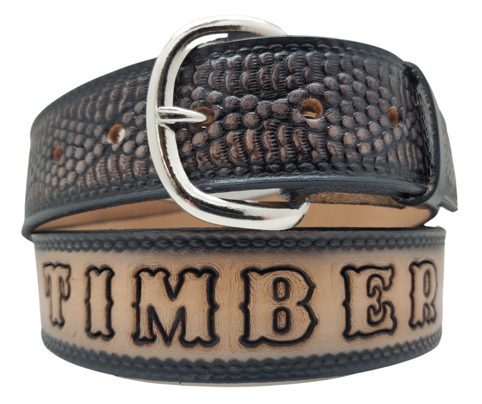 This all leather belt features a Diamondback Rattlesnake pattern in an antiqued finish with a 1 1/2" width. It is crafted from full grain veg-tanned cowhide, with smooth burnished painted edges and a nickel-plated buckle. For customizing, simply type your desired name or No Name in the "Type Name Here" section, the buckle can be easily interchanged as well. This product is in stock at our Smyrna, TN shop.