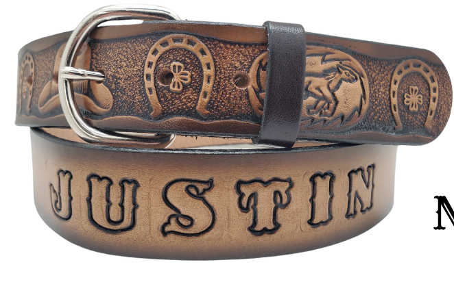 The Boots and Shoes is our leather belt with Boots/Horses/Horseshoes Pattern with Brown fade into a Natural Leather finish. Available in a 1 1/2" width. Full grain vegetable tanned cowhide, Width 1 1/2" and includes Nickle plated&nbsp; buckle Smooth burnished painted edges. Made in USA! For name Type name or No Name in "Type Name Here" section. Buckle snaps in place for easy changing if desired. In stock at our Smyrna, TN shop.