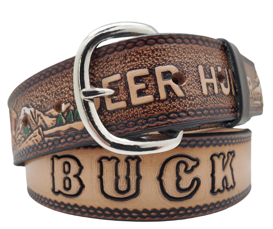 This Buck Fever all leather Name belt features a Deer Hunting pattern in an antiqued finish with a 1 1/2" width. It is crafted from full grain veg-tanned cowhide, with smooth burnished painted edges and a nickel-plated buckle.&nbsp;For customizing, simply type your desired name or No Name in the "Type Name Here" section, the buckle can be easily interchanged as well. This product is in stock at our Smyrna, TN shop.