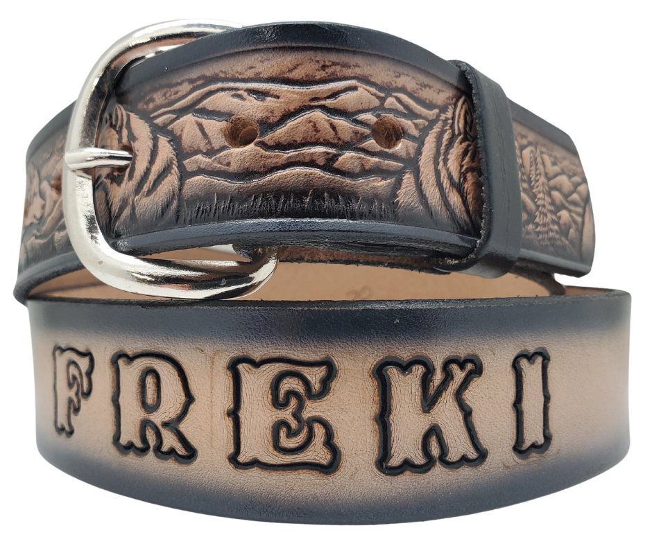 This all leather belt features a Wolf Pack pattern in an antiqued finish with a 1 1/2" width. It is crafted from full grain veg-tanned cowhide, with smooth burnished painted edges and a nickel-plated buckle. For customizing, simply type your desired name or No Name in the "Type Name Here" section, the buckle can be easily interchanged as well. This product is in stock at our Smyrna, TN shop.