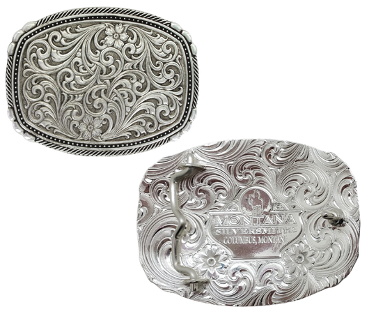 <span data-mce-fragment="1">&nbsp;</span>This buckle features a beautiful Intricate Western Scroll pattern as the main design. Its antiqued curved rectangular shape is accented with twisted silver finished rope edging and high-domed beads, framing the bright cut Western scroll design. It can fit a standard 1.5 inch belt and measures approximately 3 3/4"" across x 3" tall. You can find it at our Smyrna, TN location, just a short drive from downtown Nashville. Made by Montana Silversmith.