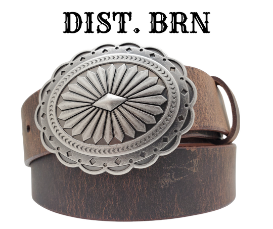 This oval Concha shaped buckle has scalloped edges, a Sunburst Diamond center. It is Antiqued silver colored, measures 2 3/4" tall by 3 3/4" wide and fits belts up to 1 1/2" wide. Buckle is made in Taiwan. Belt is a single strip of leather that is 1 1/2" wide and available in sizes 34" to 44". Colors are distressed brown, black, and dark brown. CHOOSE ONE BELT STRIP COLOR! It is available for purchase in our retail shop in Smyrna, TN, just outside Nashville and also in our online store.