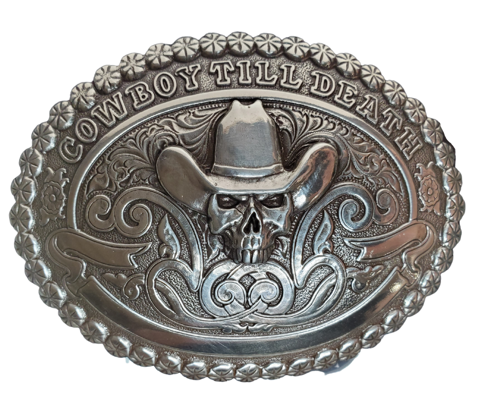 Treat your Cowboy Ways to something special. Our "Cowboy till Death" buckle has the classic vibes - scrolls, beaded edge, and a skull wearing a hat! Show your loyalty to the West! Measuring 2 1/2" tall x 3 1/2" wide, get it online or at our shop in Smyrna, TN, outside Nashville. Imported.