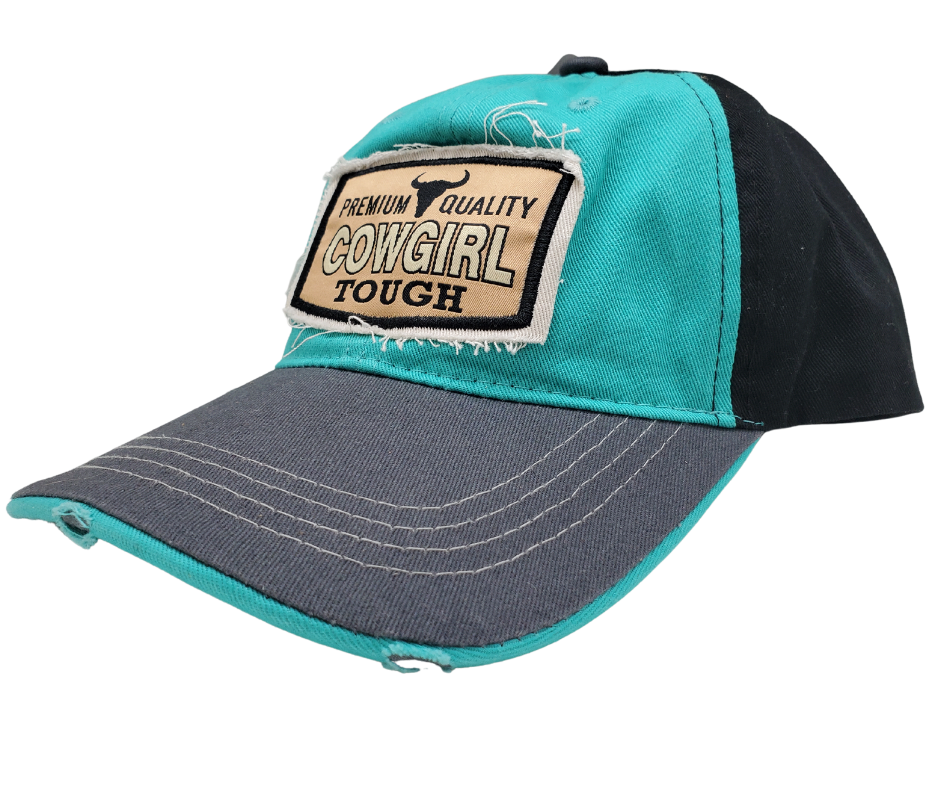 Cowgirl UP! Wear your American Cowgirl Tough Distressed Embroidered Trucker Cap with pride! The Turquoise twill front and Black back feature a Longhorn graphic with a Charcoal stitched bill, plus an adjustable snap strap to perfectly fit any size head. Take a short trip outside Nashville to our Smyrna, TN shop and get yours now!