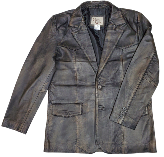 The "Carson is a butter-soft Distressed Brown Leather blazer Jacket for men is delicately distressed in a rich brown hue. Its two pockets are thoughtfully designed for convenient storage, and it is proudly presented in-store at our Smyrna TN shop, located in close proximity to Nashville. Offering luxury and refinement, this piece is sure to leave an unforgettable impression.&nbsp;Sizes S-3XL.