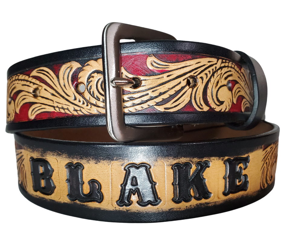 This DELUXE Rustler Name Leather Belt features a classic western Scroll pattern embossed on a 9-10 oz. vegetable-tanned cowhide. You may customize the buckle with the added snaps. It is named Deluxe because of the additional color added to the background of the pattern. This product is crafted with care in our Smyrna, TN shop, just outside Nashville, TN.