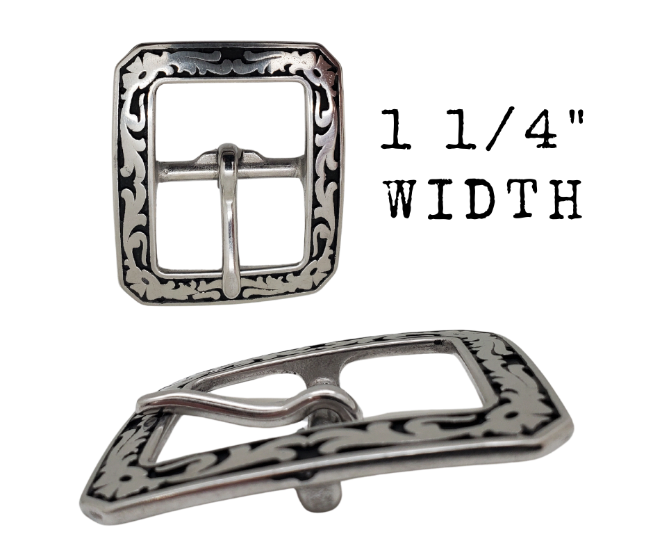 If you need a upgrade for your current belt or want a different look we have a selection of what we call Basic buckles. Stop in our shop in Smyrna, TN, just outside of Nashville. This is a Center bar style with a Western attitude.   Color - Stainless Steel w/ blk accents , 1 1/4" or 1 1/2" width