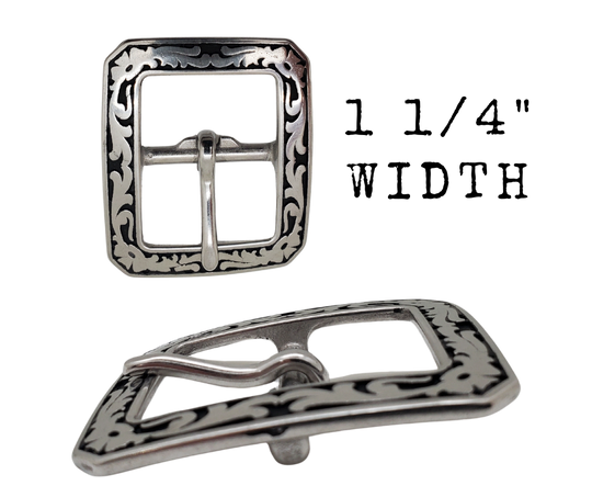 If you need a upgrade for your current belt or want a different look we have a selection of what we call Basic buckles. Stop in our shop in Smyrna, TN, just outside of Nashville. This is a Center bar style with a Western attitude.   Color - Stainless Steel w/ blk accents , 1 1/4" or 1 1/2" width