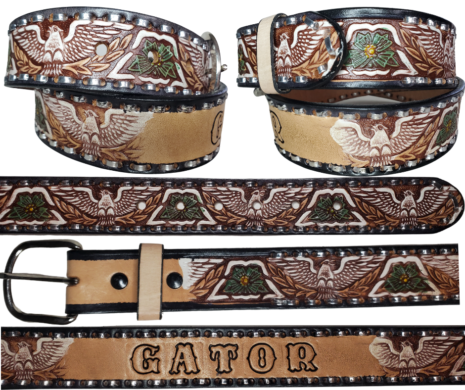 The Dimestore Cowboy leather belt is a classic Vintage Throwback Style Western belt. Complete with silver Buck Stitching and a embossed eagle design in Black/Antique White/Blue coloring. A 1 1/2" width Full grain vegetable tanned cowhide, Width 1 1/2" and includes Nickle plated  buckle Smooth burnished painted edges. Buckle snaps in place for easy changing if desired. In stock at our Smyrna, TN shop.