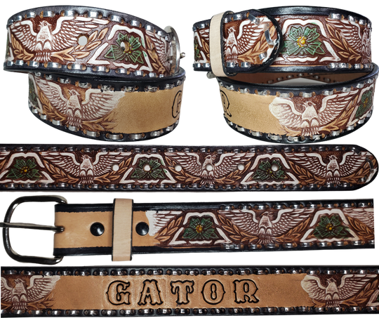 The Dimestore Cowboy leather belt is a classic Vintage Throwback Style Western belt. Complete with silver Buck Stitching and a embossed eagle design in Black/Antique White/Blue coloring. A 1 1/2" width Full grain vegetable tanned cowhide, Width 1 1/2" and includes Nickle plated  buckle Smooth burnished painted edges. Buckle snaps in place for easy changing if desired. In stock at our Smyrna, TN shop.