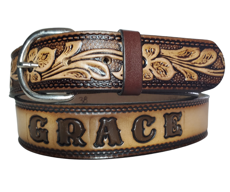 The Dogwood leather belt is the Iconic Flower Pattern with Brown fade into a Natural Leather finish. Available in a 1 1/2" width. Full grain vegetable tanned cowhide, Width 1 1/2" and includes Nickle plated  buckle Smooth burnished painted edges. Made in USA! For name Type name or No Name in "Type Name Here" section. Buckle snaps in place for easy changing if desired. In stock at our Smyrna, TN shop.