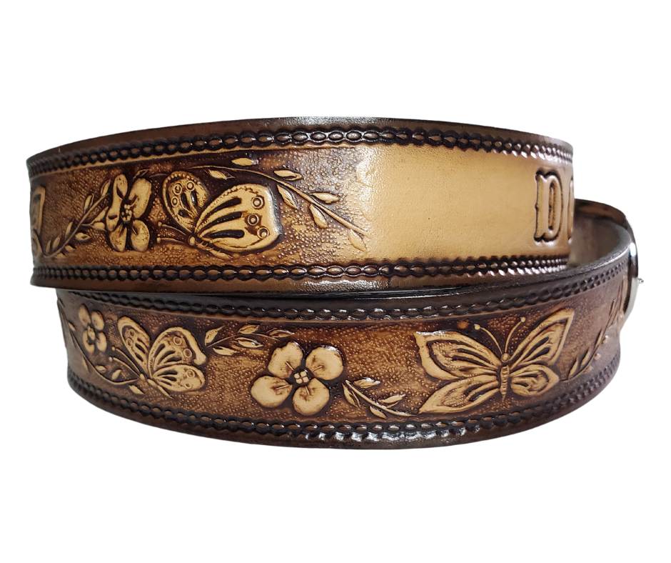  This Western styled leather Kid's belt features beautiful Flowers and Butterfly pattern that is sure to draw attention. The easy-change metal buckle makes for comfortable wear and makes it easy to add your own buckle. Perfect for adding a unique touch to any Kid's wardrobe. This belt is stocked in our shop outside Nashville in Smyrna, TN.