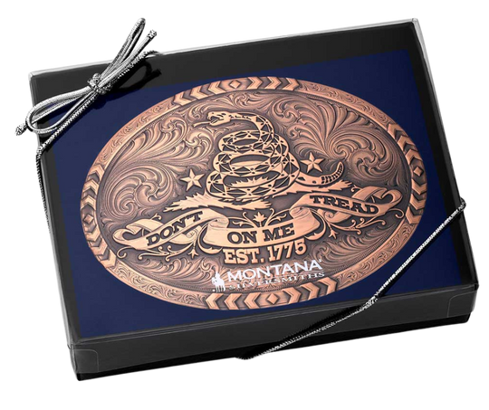 The 1776 Declaration is a Vintage Bronze Gadsden Belt Buckle. This oval buckle features a bronze tone finish. The words "Don’t Tread on Me" are featured prominently on curling ribbon at the bottom of the buckle. The Gadsden rattle snake sits ready to strike in the center of the buckle for a bold look. Chevron designs border the top, bottom, and sides giving the buckle a militant feel. Approx 4"x3" Standard 1.5 inch belt swivel. Get yours at our local Smyrna, TN not far from Nashville.