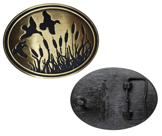 Experience the classic game, Duck Hunt, with The Duck Hunt Belt Buckle. Finished in antique brass makes a great match for our mallard belt.  Designed to fit a 1 1/2" belt and the size approx. 3-1/2" x 2-3/4. . available in our Smyrna, TN shop near Nashville, this dynamic and detailed buckle is perfect for the Duck Hunter.