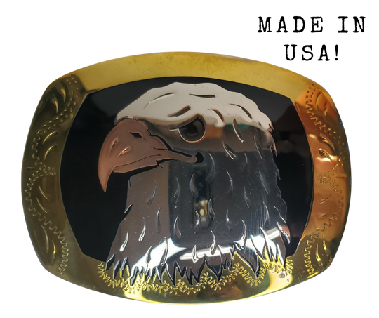 The Bald Eagle a symbol of the USA where this buckle is made! Handmade of German silver, a copper Eagle beak with a black resin inlay background and brass border.  rectangular buckle with a 2 3/4 x 3 “ size.  Available in our Smyrna TN shop just outside of Nashville.