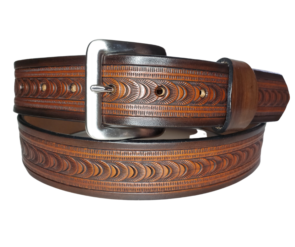 "The East Ridge" handmade all leather belt is made from a single strip of Veg-tan cowhide. The hand finished Veg-tan that is 9-10 oz., or approx. 1/8" thick in 3 color options.  The width is 1 1/2". The antique nickel plated solid brass buckle is snapped in place. This belt is made just outside Nashville in Smyrna, TN. Perfect for casual and dress wear, it can be for personal use or for groomsman gifts or other gifts as well.