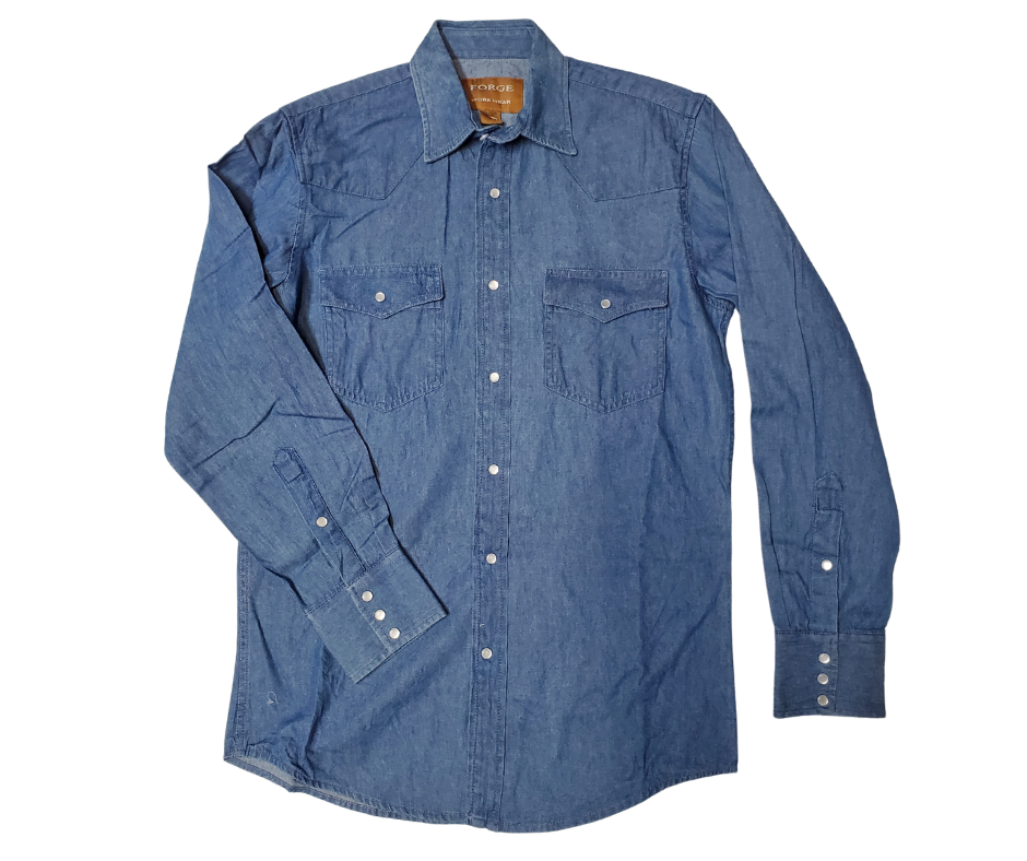 These never go out of style, always a classic! Gear up for your next adventure. Made with classic Western style in mind, this denim button down boasts two front flap pockets and snaps for easy, casual dressing.  Details: Pearl Snaps, 2 Pockets, Yokes, 100% Cotton Available in our shop in Smyrna, TN, just outside of Nashville. Imported