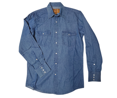 These never go out of style, always a classic! Gear up for your next adventure. Made with classic Western style in mind, this denim button down boasts two front flap pockets and snaps for easy, casual dressing.  Details: Pearl Snaps, 2 Pockets, Yokes, 100% Cotton Available in our shop in Smyrna, TN, just outside of Nashville. Imported