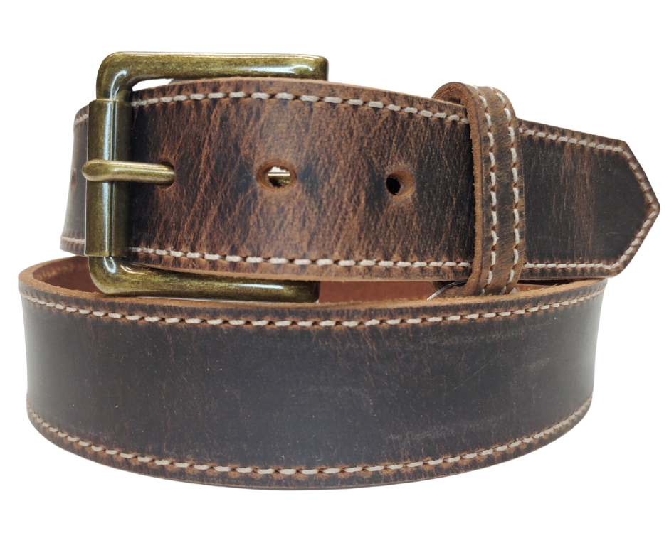 Named after the dusty trail used to herd cattle in the 1880's. This belt has the distressed look that matches so many of todays popular boots. The stitching gives just a hint of a dressed up look, it will become your go to belt for everyday use. The Antique Brass roller buckle and 1 1/2" width will work most every type of pants. Snaps make a easy buckle change for your favorite buckles. Pick yours up at our Smyrna, TN shop open 5 days a week Tue. thru Sat 9-5.