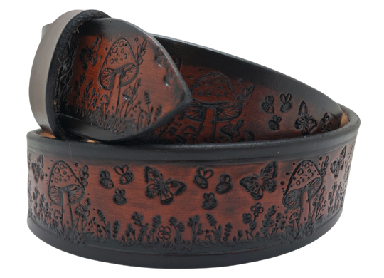 Our 1 1/2" Throwback Groovy Mushroom is a solid strip of USA veg-tan cowhide, embossed with a scene of Mushrooms, Flowers, and Butterflies down length of belt. It is hand finished in&nbsp;3 finishes, with smooth beveled, and painted edges, approx. 1/8" thick. Sizes available are&nbsp;34" to 44" from buckle end to hole most worn.&nbsp; Buckle is an Antique Silver finish brass, held in place with 2 snaps for easy buckle change. Crafted by hand at our Smyrna, Tennessee shop, close to Nashville.