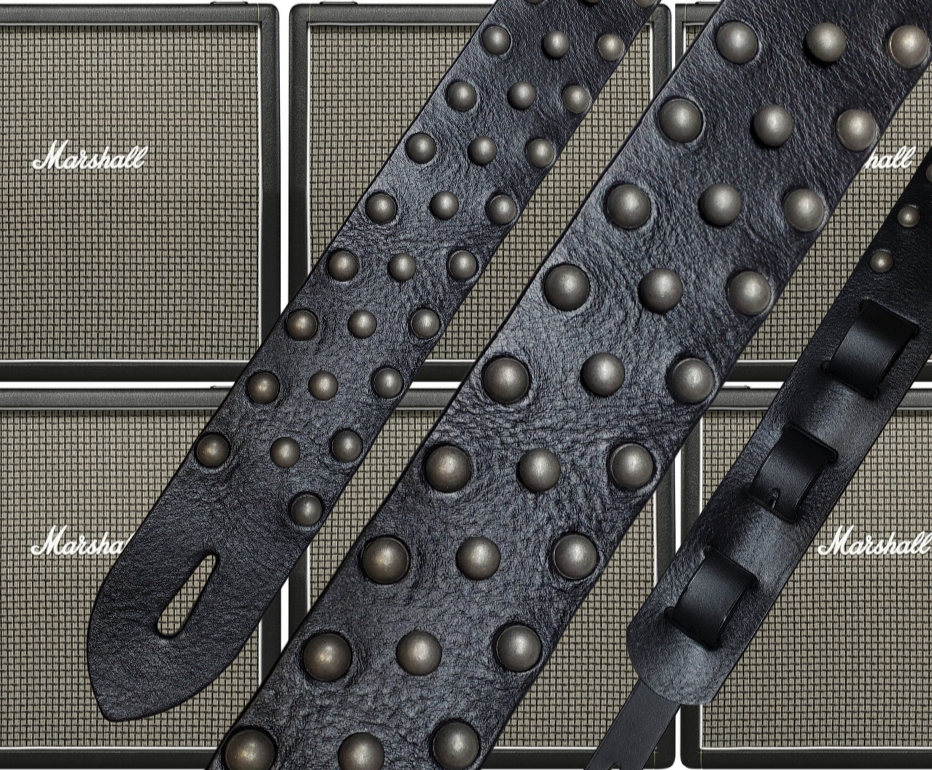 Metal Studs have been staple for years in Rock music!  "This 2" wide Guitar Strap is a nod to that classic influence. It's made from 1/8" thick Classic Black Pebble Grain Cowhide and after some gig's it'll look like you bought in a Vintage shop. The classic adjustment style goes from approx. 42" to 56" at it's longest . Made just outside Nashville in our Smyrna, TN. shop. It will need a bit of time to "break in" but will get a great patina over time.  