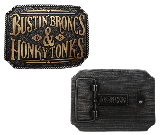 From the rodeo to dancing at night, the Rodeo life is all about attitude. Embrace the Dale Brisby code with this one-of-a-kind belt buckle featuring a scroll background and a rope edge. The rectangular shape in Antiqued silver and Antiqued brass finish perfectly fits a 1 1/2" belt and measures approximately 3" x 4". Find it online or at our shop just outside Nashville in Smyrna, TN. Made with metal alloy and coated with Montana Armor for durability.