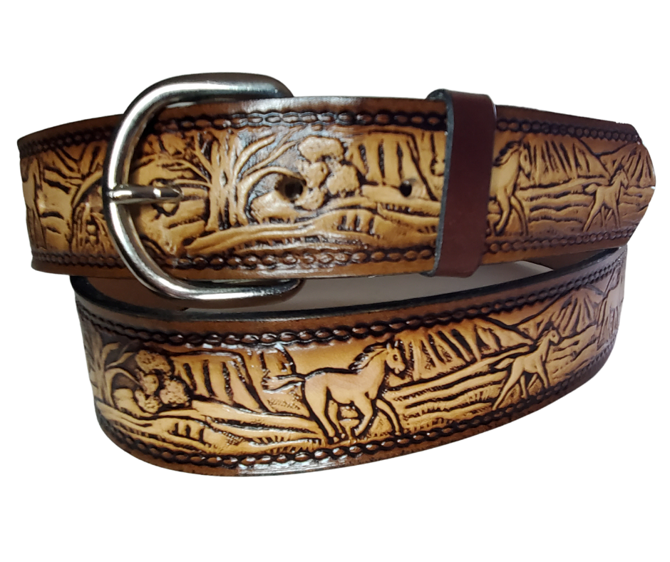 The Stallion leather belt has Horses running in the wild Brown Antiqued finish. Available in a 1 1/2" width. Full grain vegetable tanned cowhide, Width 1 1/2" and includes Nickle plated  buckle Smooth burnished painted edges. Made in USA! For name Type name OR No Name  in "Type Name Here" section.  Buckle snaps in place for easy changing if desired. In stock at our Smyrna, TN shop.