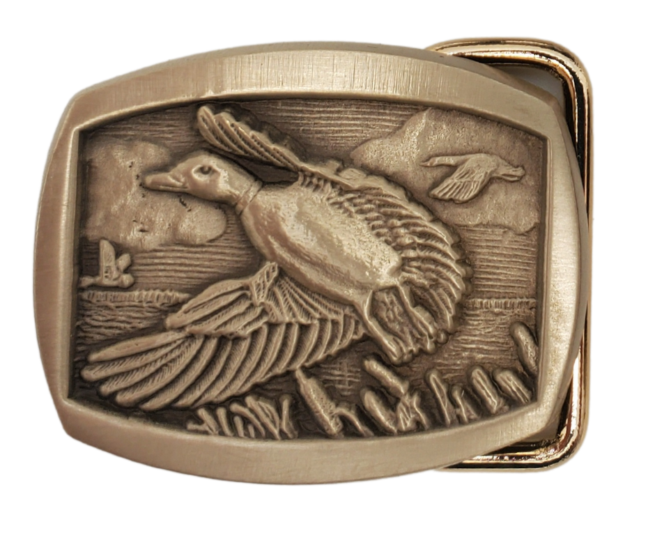 If you like narrow belts and buckles this antique Bronze belt buckle is perfect for you. Rectangle/Oval shaped with rounded corners, featuring a Flying Duck on a cattail edged lake. Don't miss out on getting it online or in-store at our shop near Nashville in Smyrna, TN.