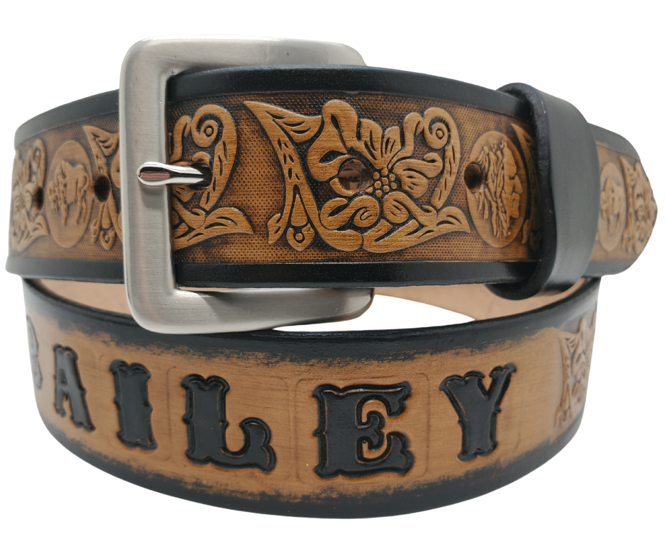 This unique Name Belt features a hand-stained strip of vegetable tanned leather, displaying a Western Scroll design and both sides of the iconic Buffalo Nickel pattern. The antique nickel finish solid brass buckle can be easily changed. Handcrafted in our Smyrna, Tennessee shop, near Nashville.