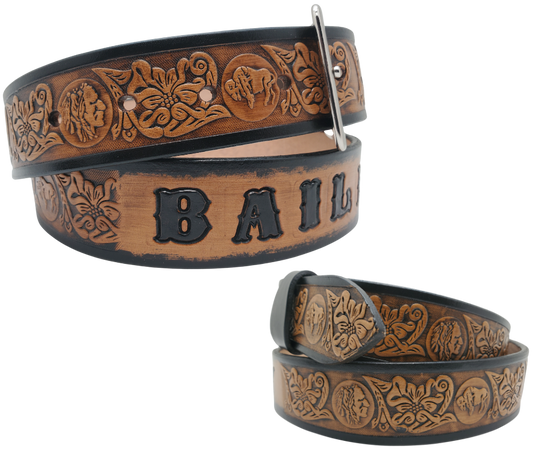 This unique Name Belt features a hand-stained strip of vegetable tanned leather, displaying a Western Scroll design and both sides of the iconic Buffalo Nickel pattern. The antique nickel finish solid brass buckle can be easily changed. Handcrafted in our Smyrna, Tennessee shop, near Nashville.