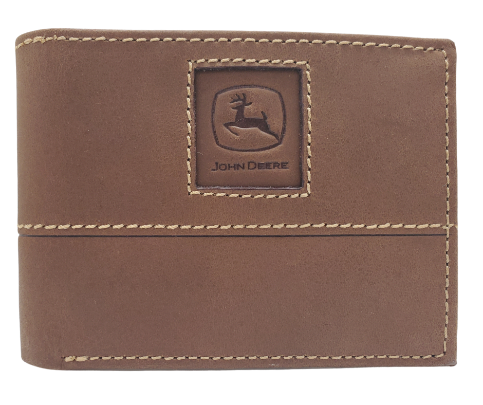 Fully Licensed John Deere Logo Bifold Wallet. Made from Distressed Brown leather with contrast stitched antique white thread. Classic Bifold design with 6 canvas card slots along 2 underside pockets, large cash slot featuring a doubled sided flip style I.D. slots. In stock at our Smyrna, TN retail store 30 min. from downtown Nashville. Imported.