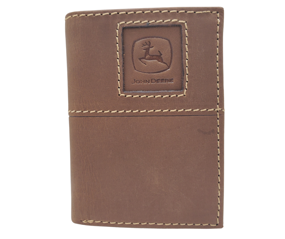 Fully Licensed John Deere Logo Trifold Wallet. Made from Distressed Brown leather with contrast stitched antique white thread. Classic Trifold design with 6 canvas card slots along 2 underside pockets, large cash slot featuring a doubled sided flip style I.D. slots. In stock at our Smyrna, TN retail store 30 min. from downtown Nashville. Imported.