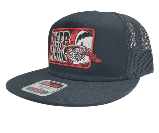 Get ready to ride with the Keep On Riding Bobber Monster Flat Bill Snapback Cap! This trendy cap features a mesh back, structured top to keep its shape, and a bold red embroidered patch that exclaims "Keep on Riding" with a graphic of a fierce Bobber Monster. Available now at our shop just outside Nashville in Smyrna, TN. Are you ready to take on the road in style?