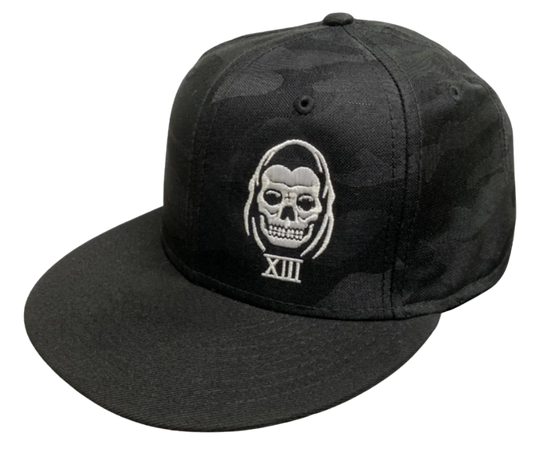 The Lucky 13 Speed Reaper "all over" Camo snapback trucker cap has the "Reaper-inspired" graphic on front and a "13" embroidered on the back left side. There is an adjustable snap back to assist in helping this hat fit almost any size head. Come and and get'em at our Smyrna, TN shop a short ride outside Nashville.

COLOR: BLACK